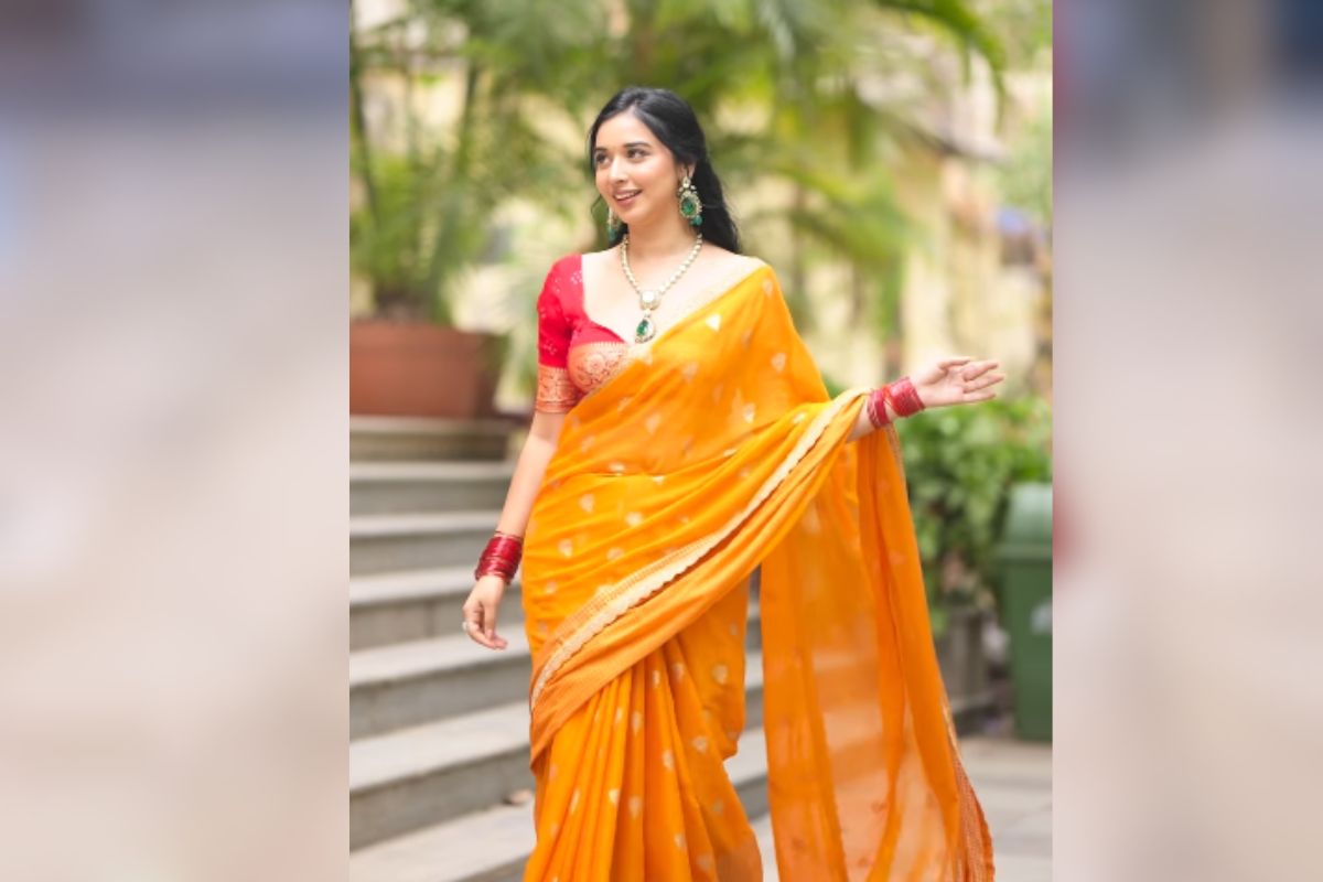 tanya mittal orange saree